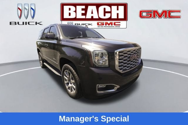 2018 GMC Yukon Denali in Iridium Metallic — front three-quarter view