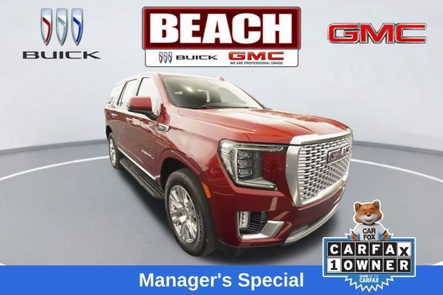 2024 GMC Yukon Denali in Volcanic Red Tintcoat — front three-quarter view