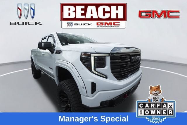 2023 GMC Sierra 1500 AT4 in Summit White — front three-quarter view