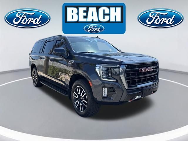 2023 GMC Yukon XL AT4 in Titanium Rush Metallic — front three-quarter view